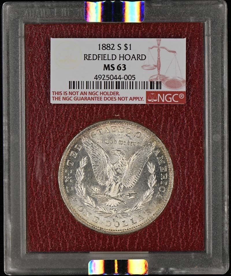 1882 S $1 Morgan Silver Dollar Redfield Hoard NGC MS63: 1882 S $1 Morgan Silver Dollar Redfield Hoard NGC MS63 1882-S Morgan Dollar from the Redfield Hoard, graded MS63 by NGC. This uncirculated United States silver dollar is offered in pre-owned condition