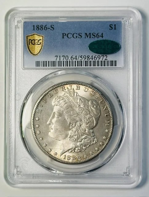 PCGS MS-64 CAC 1886-S Morgan Silver Dollar: PCGS MS-64 CAC 1886-S Morgan Silver Dollar 1886-S Morgan Silver Dollar certified by PCGS and CAC in MS-64 grade. This pre-owned silver dollar was minted in San Francisco and carries the 1886-S $1 desi