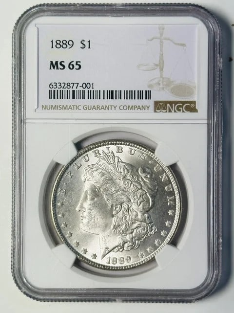 NGC MS 65 1889 Philadelphia Morgan Silver Dollar: NGC MS 65 1889 Philadelphia Morgan Silver Dollar 1889 P Morgan Silver Dollar certified by NGC and graded MS 65. This pre-owned coin is composed of silver and has a white designation. Specifications It