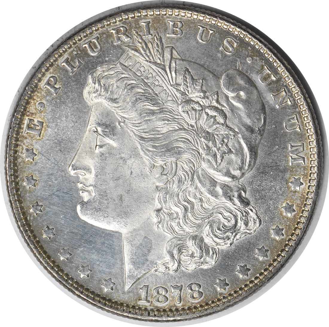 Uncirculated 1878 Silver Dollar Morgan 7 Tail Feathers Reverse Brilliant BU: Uncirculated 1878 Silver Dollar Morgan 7 Tail Feathers Reverse Brilliant BU This 1878 Morgan Silver Dollar features the 7 Tail Feathers Reverse of 1878 design. The coin is in Brilliant Uncirculated (B