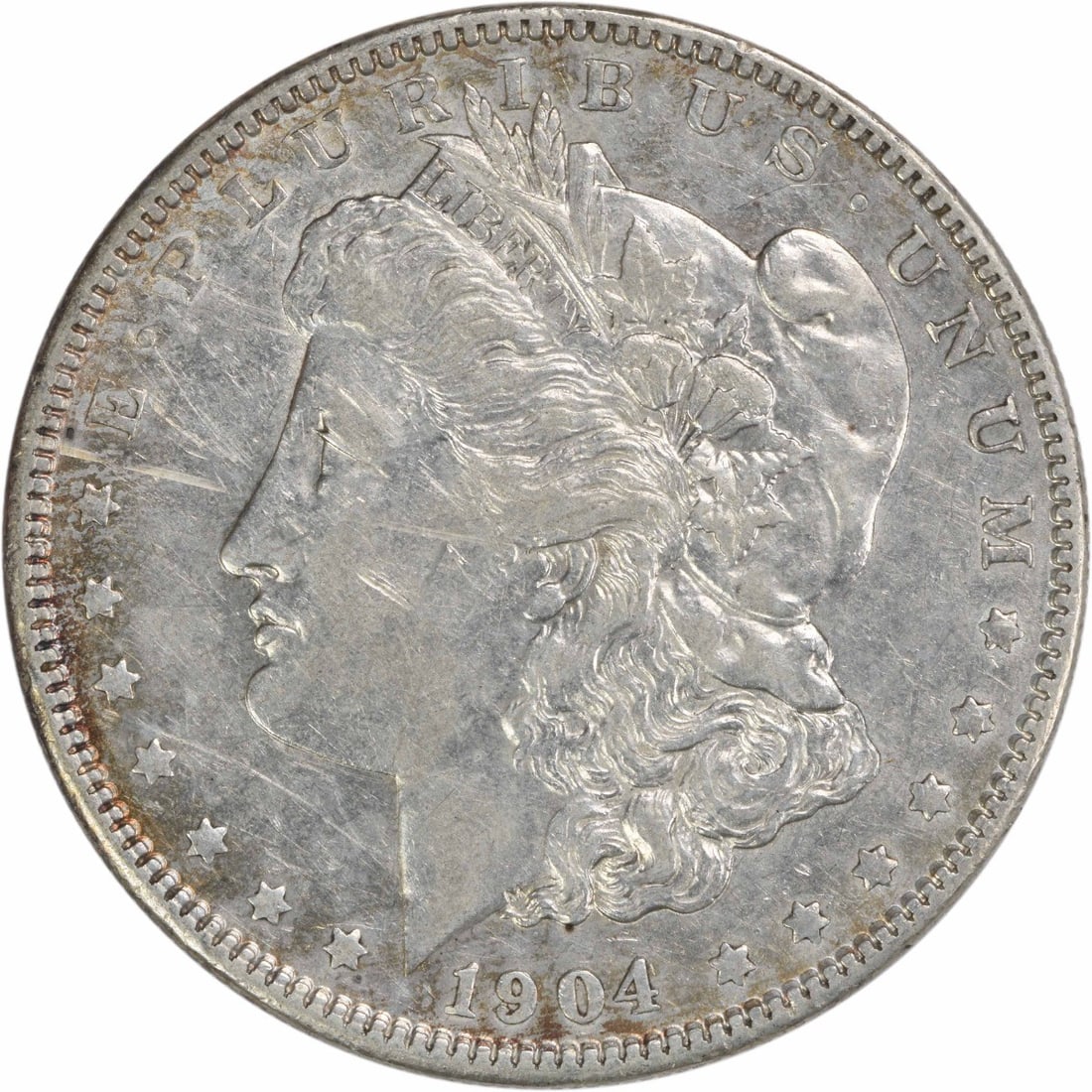 1904 Morgan Silver Dollar EF Uncertified 90% Silver Coin: 1904 Morgan Silver Dollar EF Uncertified 90% Silver Coin This 1904 Morgan Silver Dollar is a remarkable piece of numismatic history, featuring a design by George T. Morgan. Graded as EF (Extremely Fin
