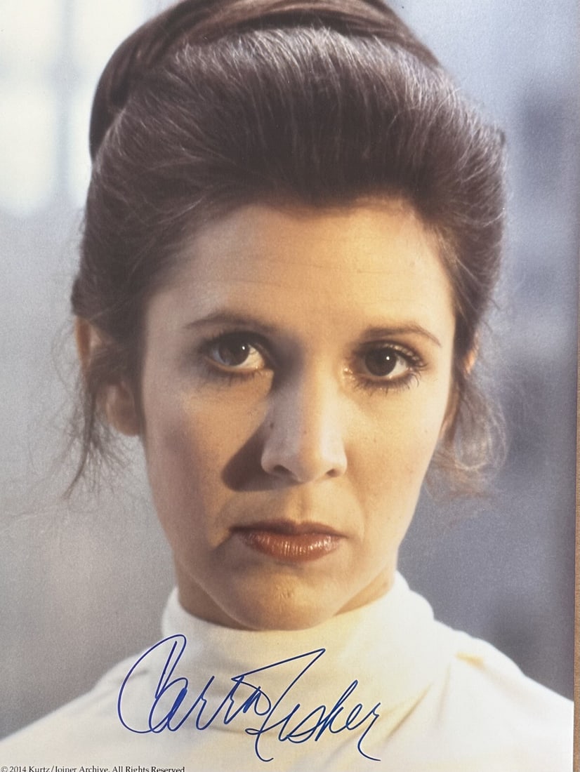 Beckett LOA Carrie Fisher signed 12x16 Princess Leia ESB photo: Beckett LOA Carrie Fisher signed 12x16 Princess Leia ESB photo Original 12x16 photograph from Star Wars: The Empire Strikes Back, signed by Carrie Fisher in blue permanent marker. The autograph is aut