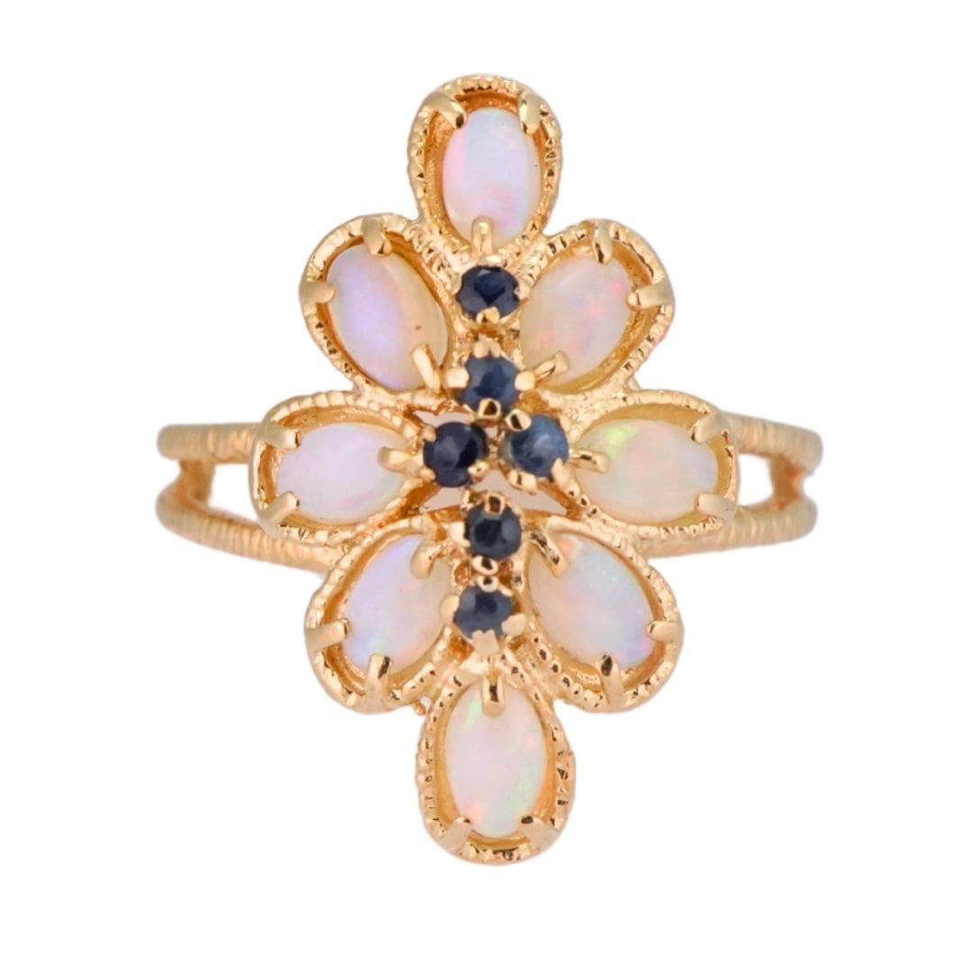 Unbranded 14K Yellow Gold Ring with Natural Opal and Blue Sapphires: Unbranded 14K Yellow Gold Ring with Natural Opal and Blue Sapphires Pre-owned 14K yellow gold ring set with natural solid opals that display a vivid play of red, green, and blue color, accented by blu
