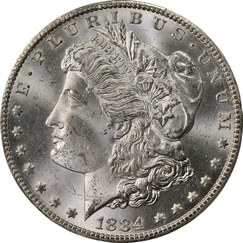 PCGS MS63 1884 CC Morgan Dollar Silver: PCGS MS63 1884 CC Morgan Dollar Silver This 1884-CC Morgan Silver Dollar is certified by PCGS with a grade of MS63. Struck in Carson City, it features a bright, lustrous appearance with strong strike 