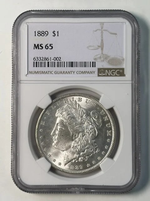 NGC MS-65 1889 Morgan Silver Dollar: NGC MS-65 1889 Morgan Silver Dollar 1889 Morgan Silver Dollar graded MS 65 by NGC. This pre-owned coin is composed of silver and carries the classic Morgan Dollar design. Specifications Item Type: Coi