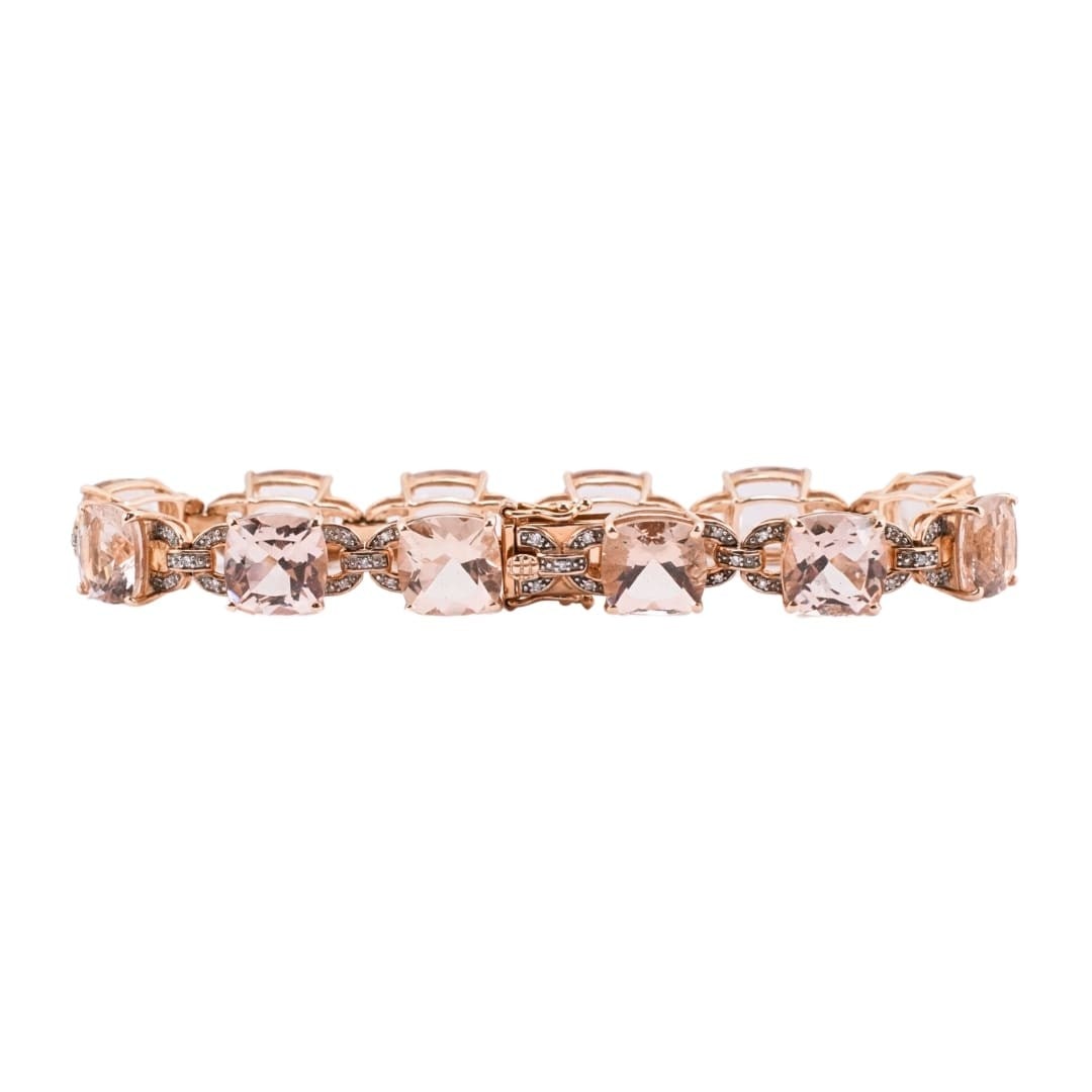 Unbranded 14K Yellow Gold Tennis Bracelet with Morganite and Diamonds: Unbranded 14K Yellow Gold Tennis Bracelet with Morganite and Diamonds A pre-owned 14K yellow gold tennis bracelet set with natural cushion-cut champagne morganite and round diamond accents. The bracel