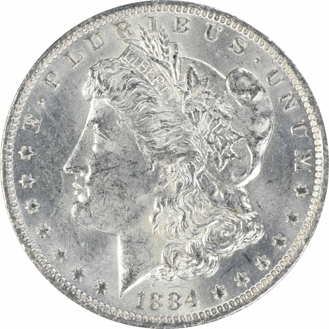 1884 O Morgan Silver Dollar $1 Uncirculated Uncertified: 1884 O Morgan Silver Dollar $1 Uncirculated Uncertified 1884-O Morgan Silver Dollar in uncirculated, uncertified condition. This pre-owned United States $1 coin is composed of silver and identified as