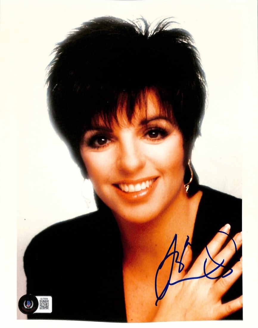 Beckett Certified Liza Minnelli Autographed 8x10 Photo: Beckett Certified Liza Minnelli Autographed 8x10 Photo Original 8x10 photograph signed by Liza Minnelli in blue permanent marker. The autograph is authenticated by Beckett. Pre-owned. Specifications I