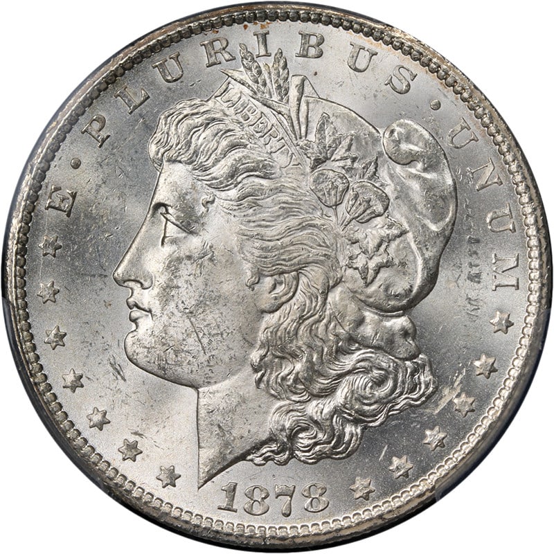 PCGS MS63 1878 CC Morgan Silver Dollar Blast White: PCGS MS63 1878 CC Morgan Silver Dollar Blast White Original 1878-CC Morgan Silver Dollar graded PCGS MS63. This uncirculated silver coin is described as blast white with strong strike, fantastic luste