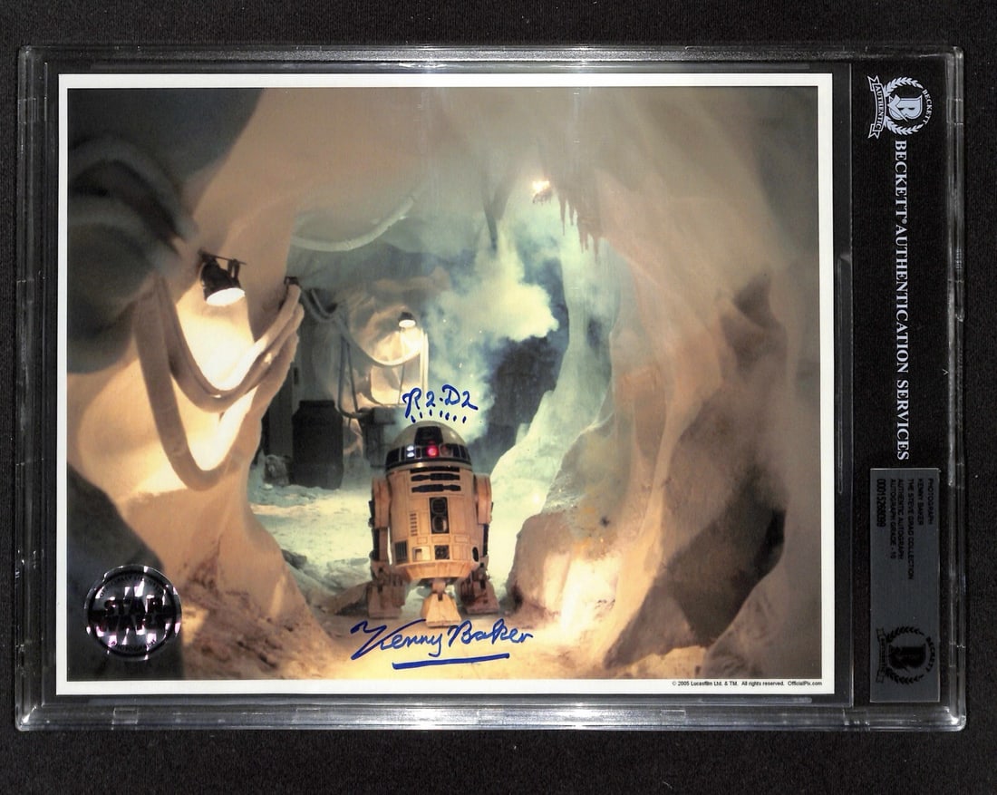 Kenny Baker signed R2-D2 ESB 8x10 photo Beckett Auto Grade 10: Kenny Baker signed R2-D2 ESB 8x10 photo Beckett Auto Grade 10 Original color 8x10 photograph from Star Wars: The Empire Strikes Back, signed by Kenny Baker as R2-D2 in blue permanent marker. The autog