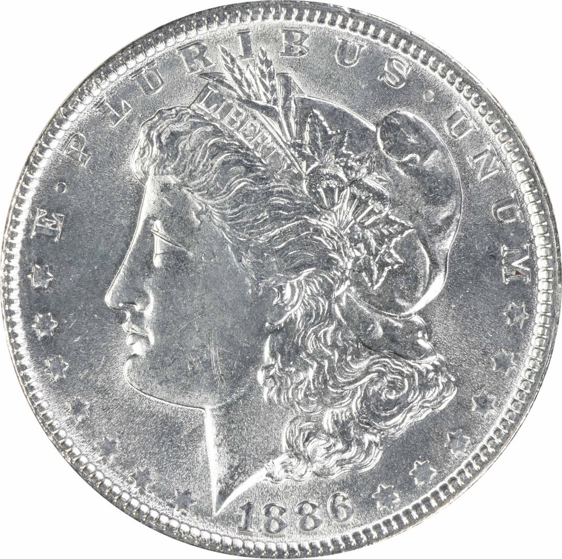 1886 Uncertified Morgan Silver Dollar $1 Uncirculated: 1886 Uncertified Morgan Silver Dollar $1 Uncirculated 1886 Morgan Silver Dollar in uncirculated, pre-owned condition. This silver $1 coin is listed as Choice BU and graded MS63, with no mint mark note