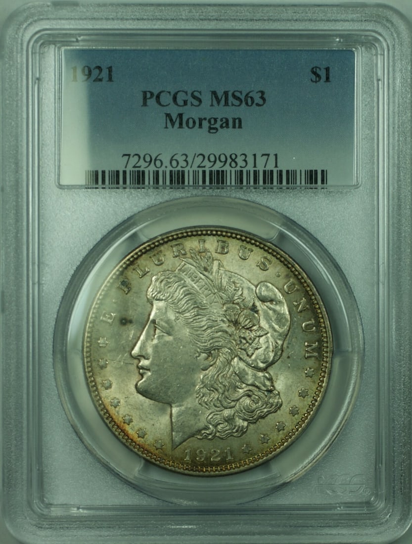 PCGS MS-63 1921 Morgan Dollar Silver $1 Toned Coin: PCGS MS-63 1921 Morgan Dollar Silver $1 Toned Coin This 1921 Morgan Silver Dollar is graded MS-63 by PCGS and features attractive toning. Minted in Philadelphia, it is composed of 90% silver and is un