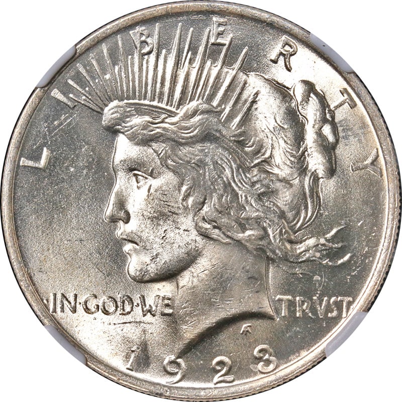 NGC MS63 1923-P Peace Dollar Silver Uncirculated: NGC MS63 1923-P Peace Dollar Silver Uncirculated 1923-P Peace Dollar certified by NGC as MS63. This uncirculated silver coin is described as bright white with nice eye appeal, luster, and strike. This