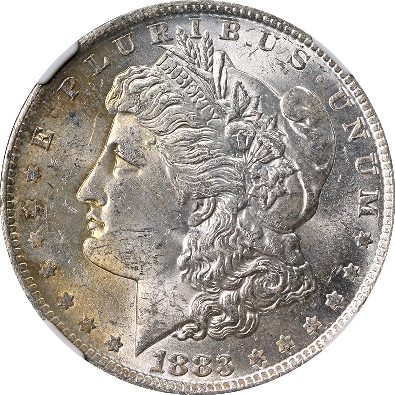 NGC MS63 1883-O Morgan Silver Dollar Toned: NGC MS63 1883-O Morgan Silver Dollar Toned This 1883-O Morgan Silver Dollar is graded MS63 by NGC and features attractive toning. Struck at the New Orleans Mint, this uncirculated coin is composed of 