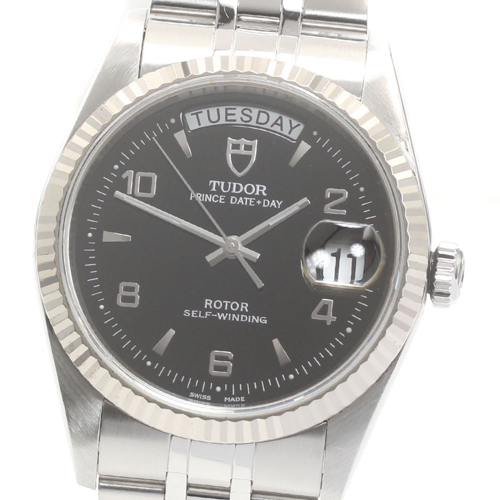 TUDOR Prince Date-Day 76214 automatic mens wristwatch black dial: TUDOR Prince Date-Day 76214 automatic mens wristwatch black dial TUDOR Prince Date-Day men's wristwatch with automatic movement and a black dial. This watch features a stainless steel case with an 18K