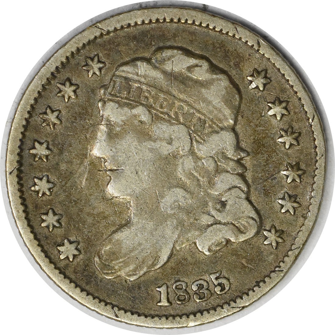 1835 Capped Bust Half Dime VF Grade Uncertified Silver Coin: 1835 Capped Bust Half Dime VF Grade Uncertified Silver Coin This is an 1835 Capped Bust Half Dime from the United States, struck at the Philadelphia Mint. The coin is composed of 89.2% silver and 10.8