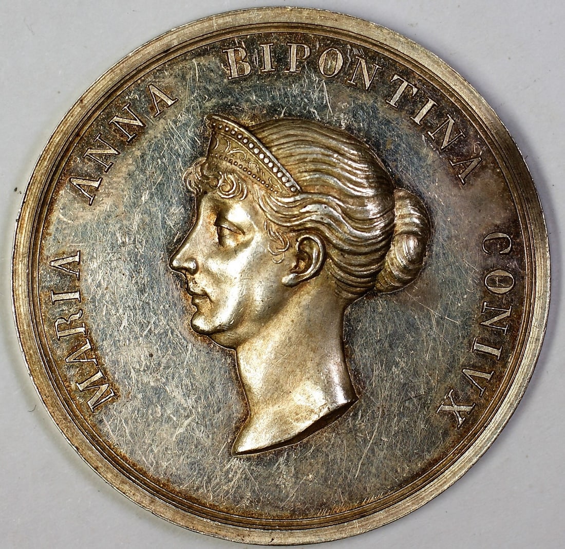 German Silver Medal Maria Anna Bipontina and Wilhelmus Dux Boloariae: German Silver Medal Maria Anna Bipontina and Wilhelmus Dux Boloariae German silver medal featuring Wilhelmus Dux Boloariae and Maria Anna Bipontina Convix. This uncirculated exonumia piece is offered 