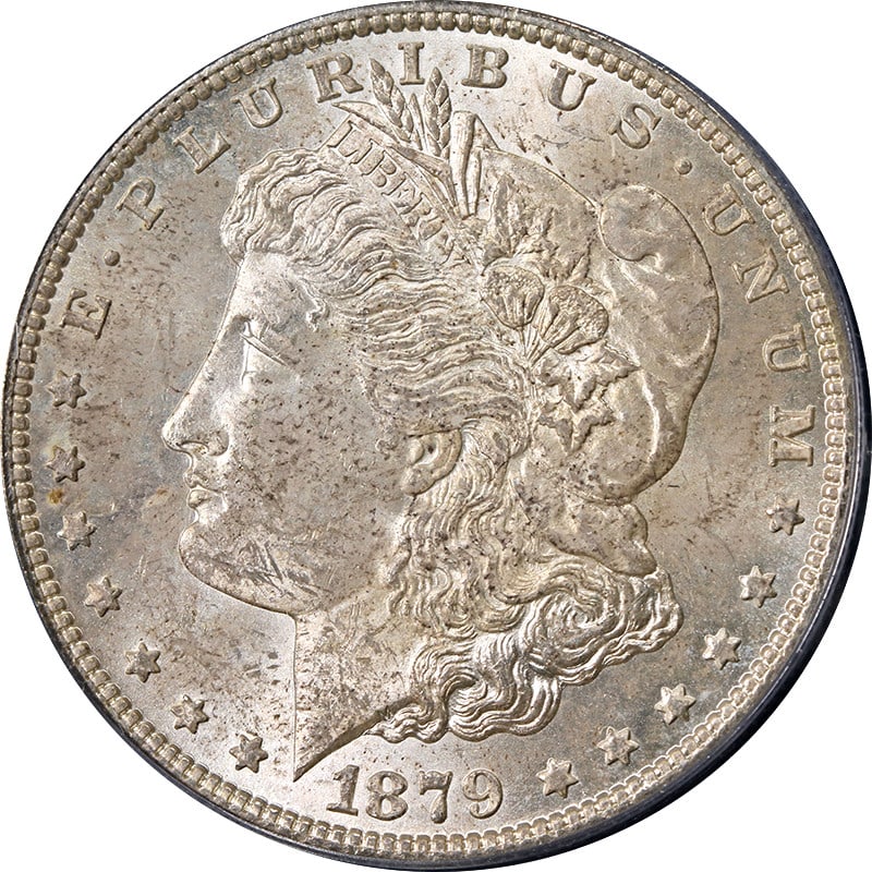 PCGS MS63 1879-S Morgan Dollar with Attractive Toning: PCGS MS63 1879-S Morgan Dollar with Attractive Toning This 1879-S Morgan Silver Dollar is certified by PCGS with a grade of MS63, indicating its uncirculated and well-preserved condition. The coin fea