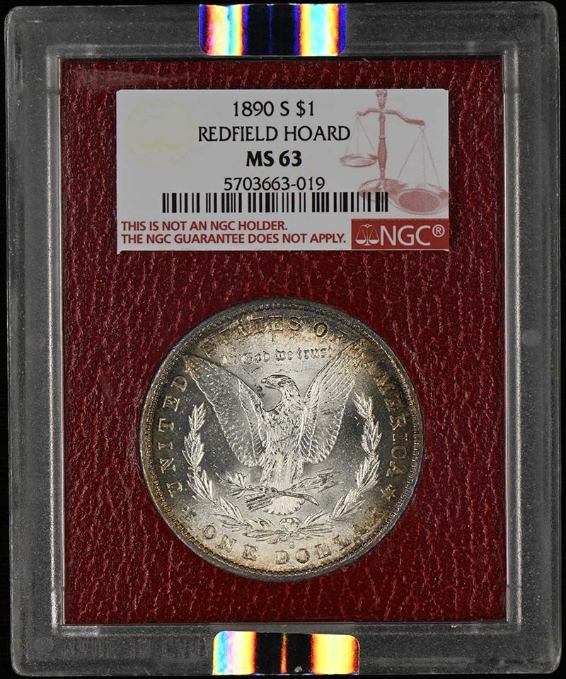 NGC MS63 1890 Morgan Silver Dollar Redfield Hoard: NGC MS63 1890 Morgan Silver Dollar Redfield Hoard 1890-S Morgan Dollar from the Redfield Hoard, certified by NGC and graded MS63. This pre-owned coin is uncirculated and was issued in the United State