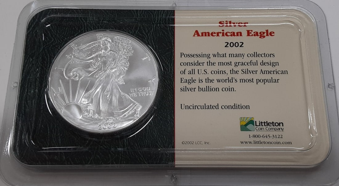 2002 Silver Eagle One Dollar Coin in Littleton Protective Plastic Case: 2002 Silver Eagle One Dollar Coin in Littleton Protective Plastic Case This is a 2002 American Silver Eagle $1 coin, composed of 1 oz troy of .999 fine silver. It comes in a Littleton clear plastic ca