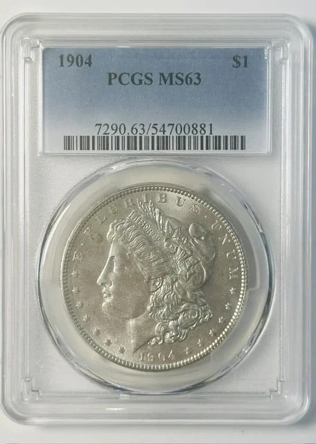 PCGS MS 63 1904 Morgan Silver Dollar Philadelphia $1: PCGS MS 63 1904 Morgan Silver Dollar Philadelphia $1 1904 Morgan Silver Dollar certified by PCGS in MS-63 grade. This pre-owned coin is composed of silver and was struck in Philadelphia. The listing i