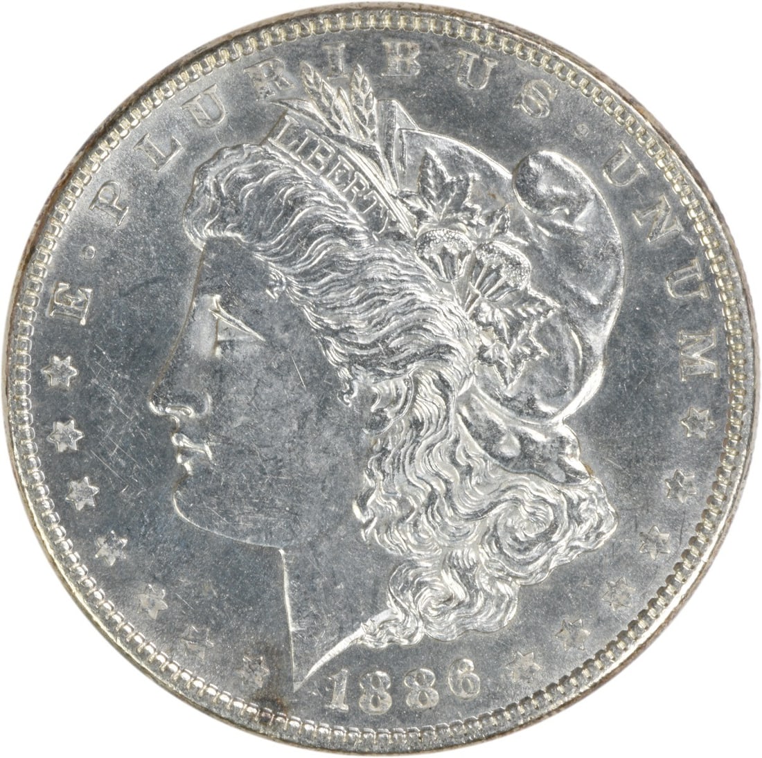 Choice BU 1886 Morgan Dollar Silver Uncirculated Uncertified Coin: Choice BU 1886 Morgan Dollar Silver Uncirculated Uncertified Coin This is an 1886 Morgan Silver Dollar from the United States, featuring a Choice Brilliant Uncirculated (BU) grade. The coin is compose