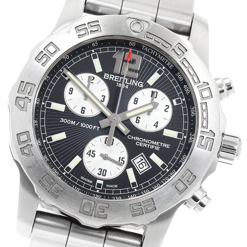Breitling Colt A73387 mens quartz chronograph wristwatch: Breitling Colt A73387 mens quartz chronograph wristwatch Breitling Colt chronograph wristwatch with a quartz movement, black and silver dial, and stainless steel case and bracelet. Features include a 