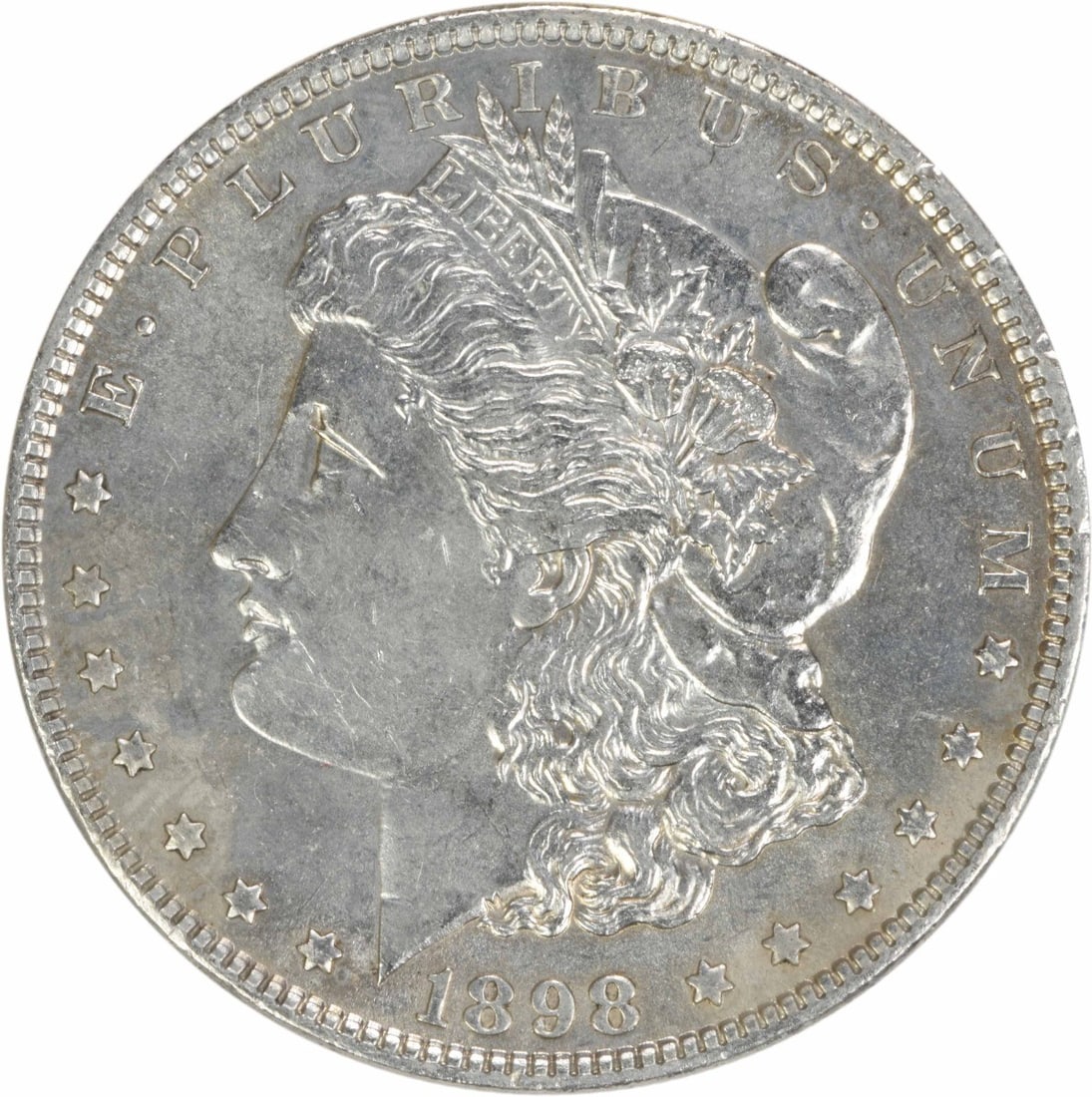 Brilliant Uncirculated 1898 Silver Dollar Morgan Uncertified No Mint Mark: Brilliant Uncirculated 1898 Silver Dollar Morgan Uncertified No Mint Mark This 1898 Morgan Silver Dollar is a Brilliant Uncirculated (BU) coin from the United States. It is composed of silver, feature