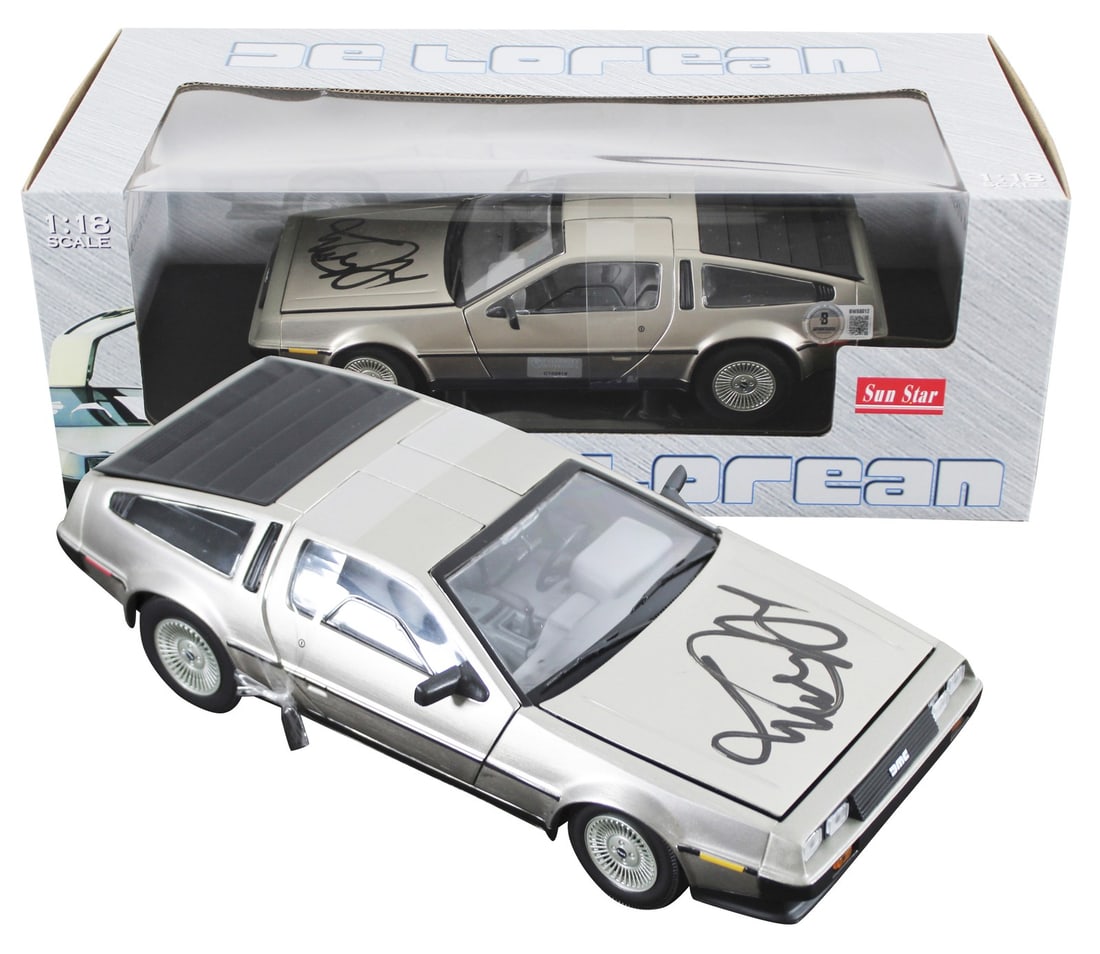Beckett authenticated Michael J Fox signed 1:18 DeLorean Time Machine model: Beckett authenticated Michael J Fox signed 1:18 DeLorean Time Machine model Autographed 1:18 scale die-cast DeLorean Time Machine from Back To The Future, personally signed by Michael J. Fox. This ori