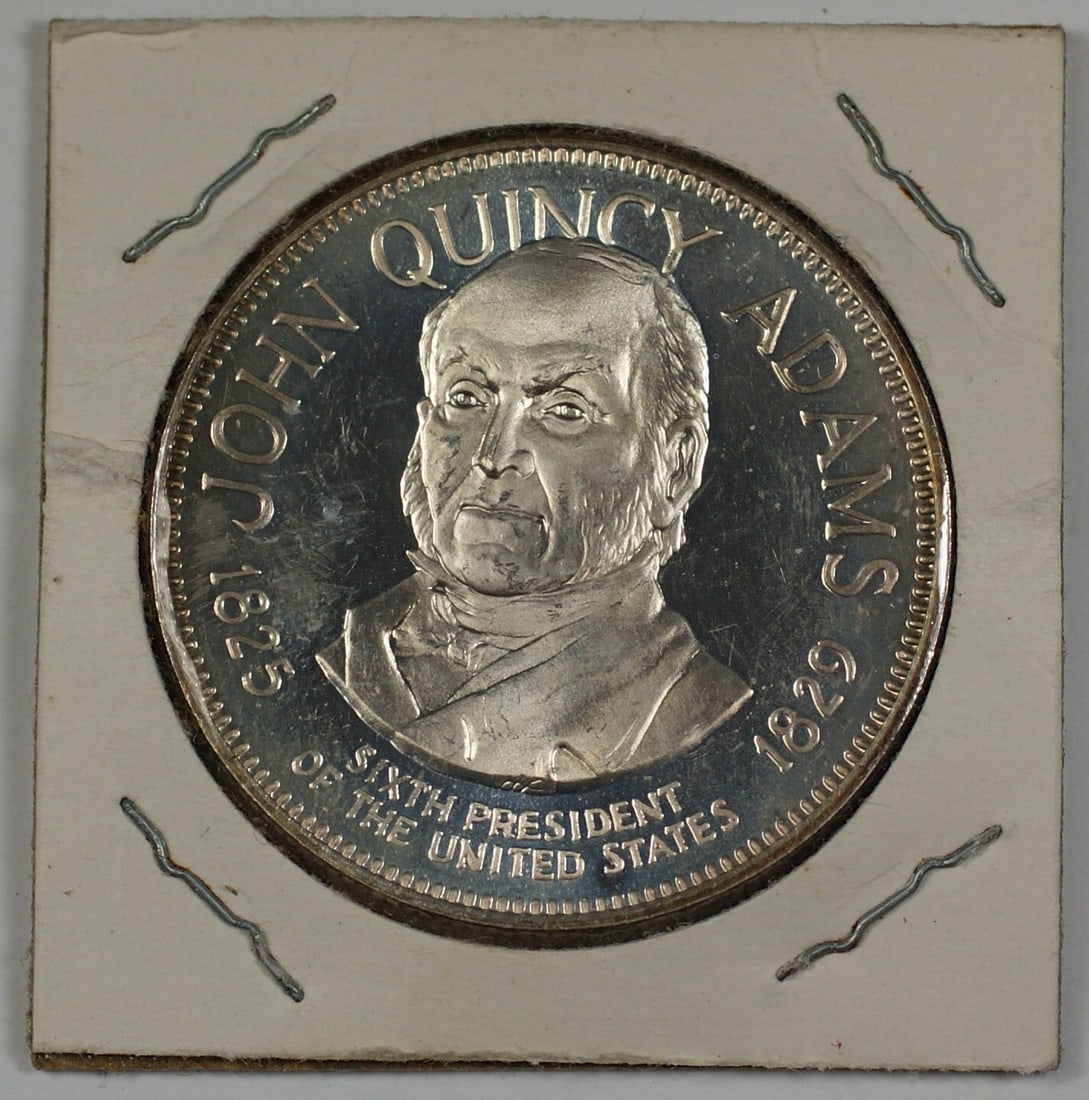 Sterling Silver John Quincy Adams Medal with Reverse Inscription: Sterling Silver John Quincy Adams Medal with Reverse Inscription Sterling silver medal featuring John Quincy Adams, with an informational blurb on the reverse. A pre-owned collectible piece from the U