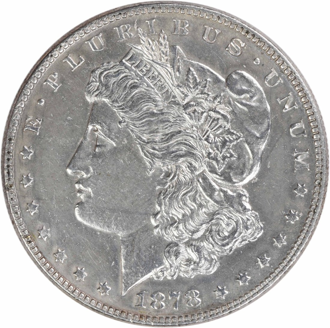 1878 Morgan Dollar Philadelphia 7 Over 8 Tail Feathers AU Silver Uncertified: 1878 Morgan Dollar Philadelphia 7 Over 8 Tail Feathers AU Silver Uncertified This 1878 Morgan Silver Dollar features a 7/8 Tail Feathers variety and is graded as About Uncirculated (AU). Struck at the