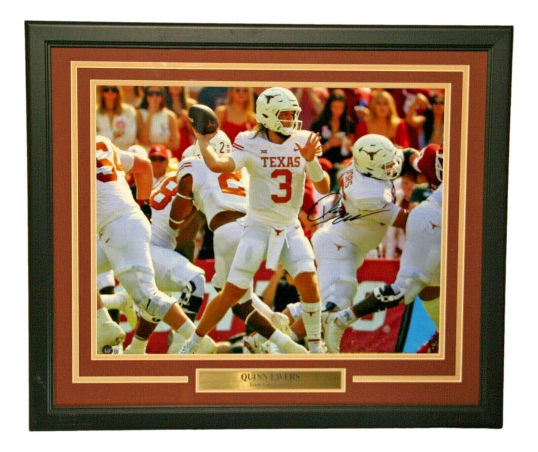 Quinn Ewers Signed 16x20 Framed Photo Texas Longhorns BAS Authenticated: Quinn Ewers Signed 16x20 Framed Photo Texas Longhorns BAS Authenticated This is a signed, framed 16x20 photo of Quinn Ewers, showcasing the Texas Longhorns football team. The item is authenticated by 