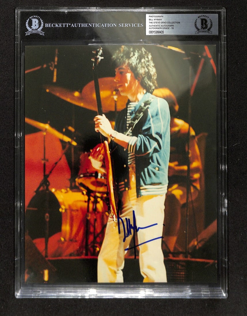 Beckett Auto 10 Bill Wyman signed 8X10 Rolling Stones photo: Beckett Auto 10 Bill Wyman signed 8X10 Rolling Stones photo Original 8x10 photograph autographed by Bill Wyman of The Rolling Stones. The signature is in blue permanent marker, and the piece has been 