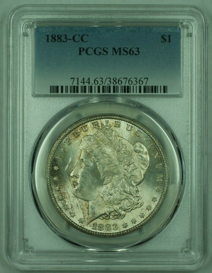 PCGS MS-63 1883 Carson City Morgan Silver Dollar with Attractive Toning: PCGS MS-63 1883 Carson City Morgan Silver Dollar with Attractive Toning This 1883-CC Morgan Silver Dollar is graded MS-63 by PCGS and features beautiful toning. Minted in Carson City, the coin is comp