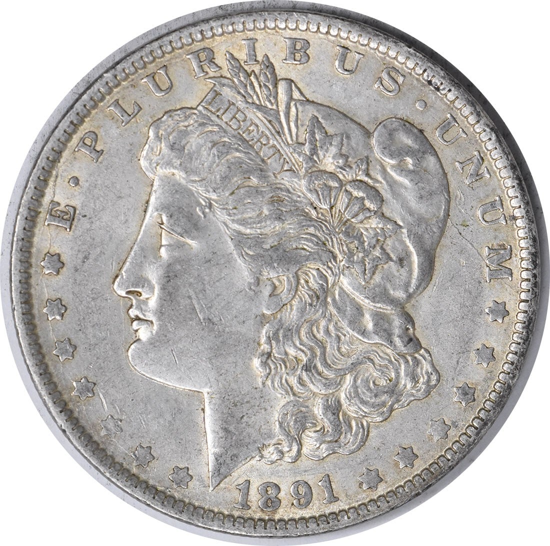 AU 1891 O Morgan Silver Dollar Uncertified $1 Coin: AU 1891 O Morgan Silver Dollar Uncertified $1 Coin 1891-O Morgan Silver Dollar in AU grade. This pre-owned, circulated coin is an uncertified example of the classic Morgan dollar series designed by Ge