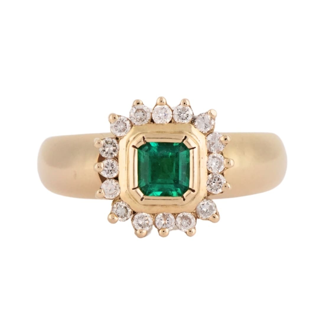 Unbranded 18K Yellow Gold Ring with Natural Emerald and Diamonds: Unbranded 18K Yellow Gold Ring with Natural Emerald and Diamonds Refined pre-owned ring crafted in 18K yellow gold and centered with a natural square step cut emerald in bright green. Round brilliant 