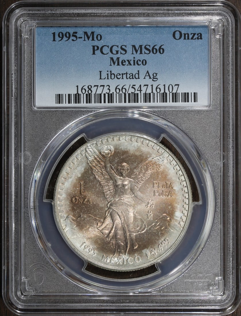 Mexico 1995-Mo Silver Libertad Onza 1 oz PCGS MS66 Toned: Mexico 1995-Mo Silver Libertad Onza 1 oz PCGS MS66 Toned 1995-Mo Mexico Silver Libertad Onza coin graded MS66 by PCGS. This pre-owned 1 oz silver coin has a toned appearance and features 0.999 fine si