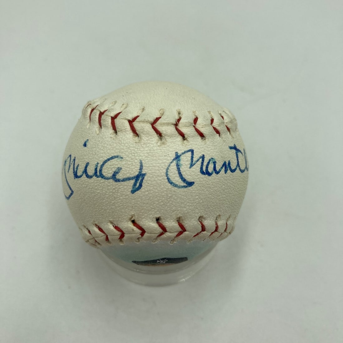 Mini American League Baseball with Mickey Mantle Autograph JSA COA: Mini American League Baseball with Mickey Mantle Autograph JSA COA Rare mini American League baseball signed by Mickey Mantle and featuring a hand-painted portrait on one panel. This original pre-owne