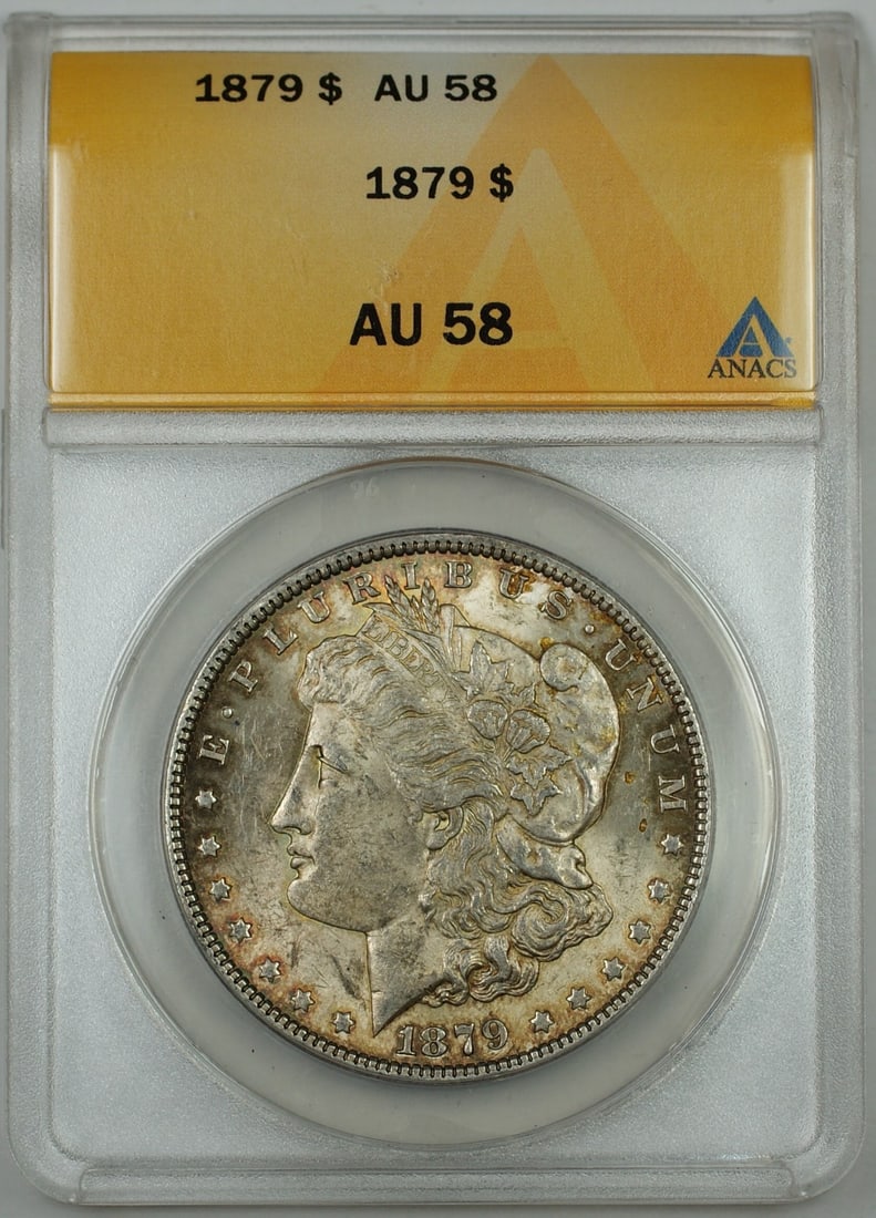 ANACS AU 58 1879 Morgan Silver Dollar Lightly Toned: ANACS AU 58 1879 Morgan Silver Dollar Lightly Toned 1879 Morgan Silver Dollar coin graded AU-58 by ANACS with light toning. This pre-owned coin is uncirculated and struck in silver. Specifications Yea