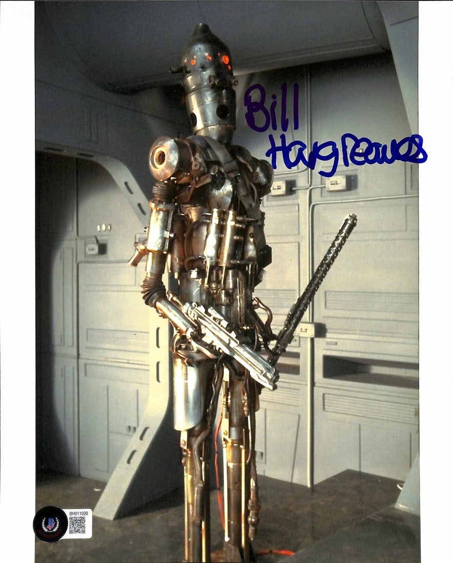 Beckett Certified 8x10 Star Wars ESB Photo Signed by Bill Hargreaves as IG-88: Beckett Certified 8x10 Star Wars ESB Photo Signed by Bill Hargreaves as IG-88 Original 8x10 color photograph from Star Wars: The Empire Strikes Back, signed by Bill Hargreaves in blue permanent marker
