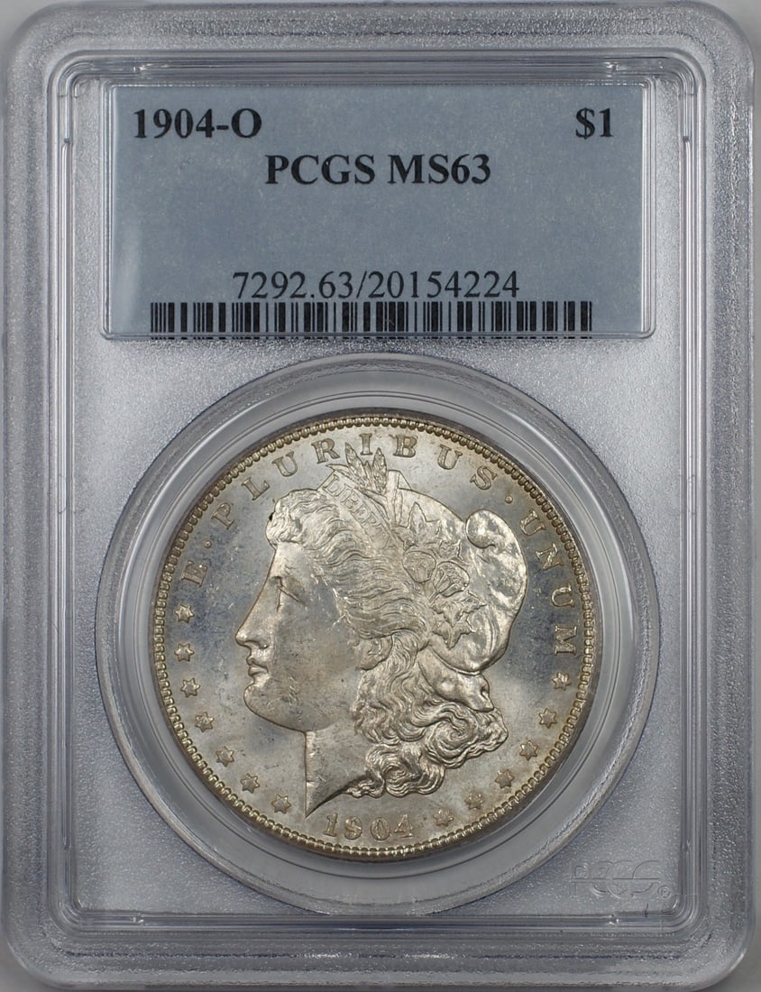 PCGS MS-63 1904-O Morgan Silver Dollar Lightly Toned: PCGS MS-63 1904-O Morgan Silver Dollar Lightly Toned 1904-O Morgan Silver Dollar $1 coin graded PCGS MS-63 with light toning. This United States coin is an uncirculated pre-owned example struck in sil