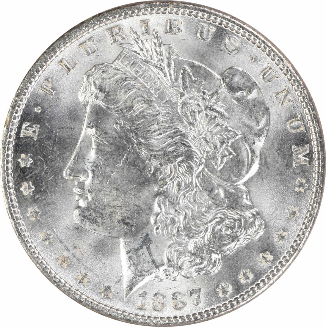 1887 Uncirculated Silver Morgan Dollar $1 Uncertified: 1887 Uncirculated Silver Morgan Dollar $1 Uncertified 1887 Morgan Silver Dollar in uncirculated condition. This uncertified silver $1 coin is identified as a Morgan dollar and is listed as pre-owned. 