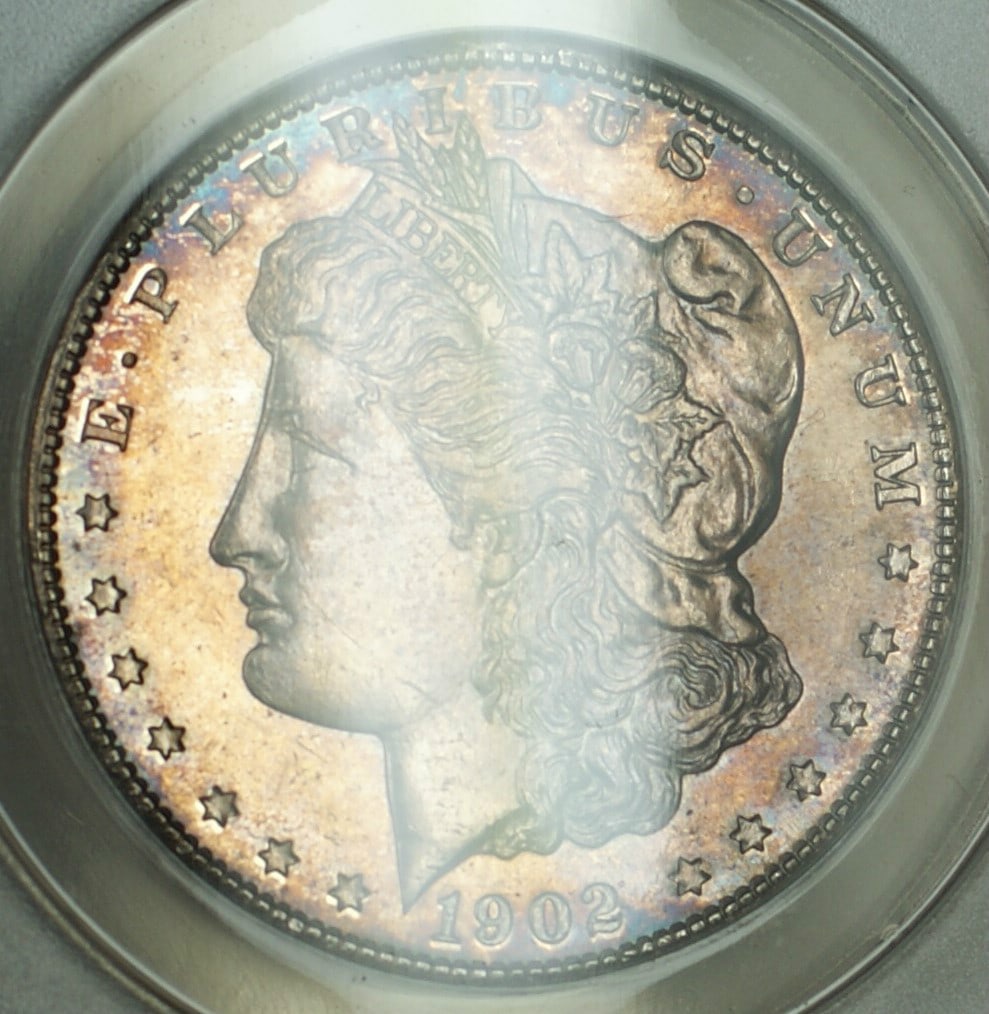 ANACS AU 58 Details 1902 O Morgan Dollar Cleaned Silver Coin: ANACS AU 58 Details 1902 O Morgan Dollar Cleaned Silver Coin 1902-O Morgan Silver Dollar coin from the United States, certified by ANACS and graded AU-58 Details, Cleaned. This circulated silver dolla