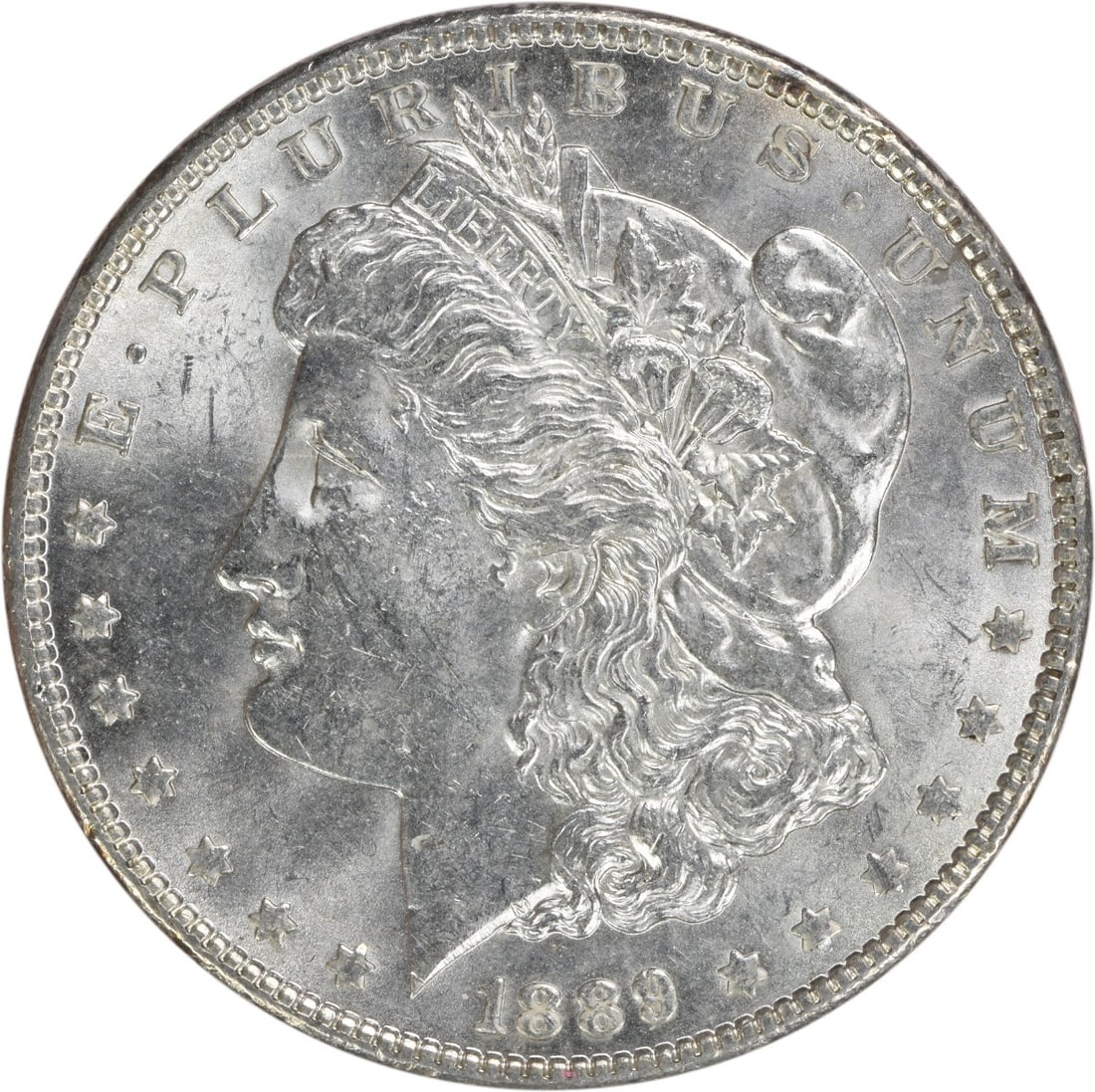 1889 Brilliant Uncirculated Morgan Silver Dollar Uncertified No Mint Mark: 1889 Brilliant Uncirculated Morgan Silver Dollar Uncertified No Mint Mark This is an uncirculated 1889 Morgan Silver Dollar from the United States. The coin is composed of silver and features no mint 