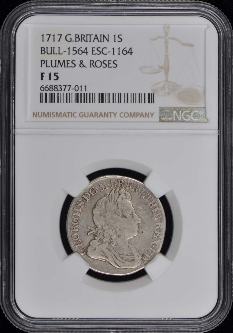 1717 Great Britain 1 Shilling Plumes and Roses NGC F15: 1717 Great Britain 1 Shilling Plumes and Roses NGC F15 1717 Great Britain Plumes & Roses one shilling coin, certified by NGC and graded F15. This circulated, pre-owned coin is encapsulated in a protec
