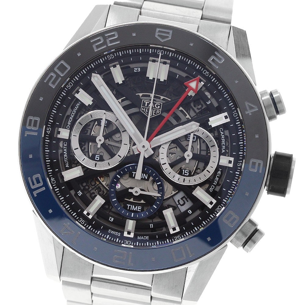 TAG Heuer Carrera Caliber Heuer02 GMT Chronograph Automatic Watch CBG2A1Z: TAG Heuer Carrera Caliber Heuer02 GMT Chronograph Automatic Watch CBG2A1Z TAG Heuer Carrera Caliber Heuer02 GMT Chronograph automatic wristwatch for men. This stainless steel watch features a skeleton