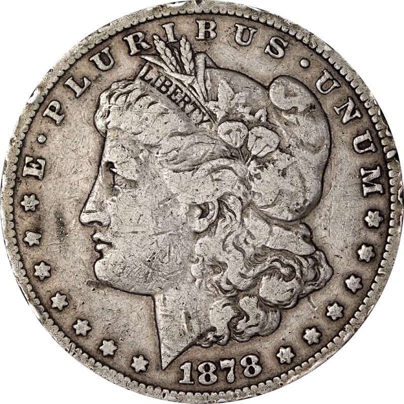 1878 CC Morgan Silver Dollar Circulated Damaged: 1878 CC Morgan Silver Dollar Circulated Damaged 1878-CC Morgan Silver Dollar with noted damage. This pre-owned coin is uncertified, circulated, and composed of silver. Specifications Coin Type: Morgan
