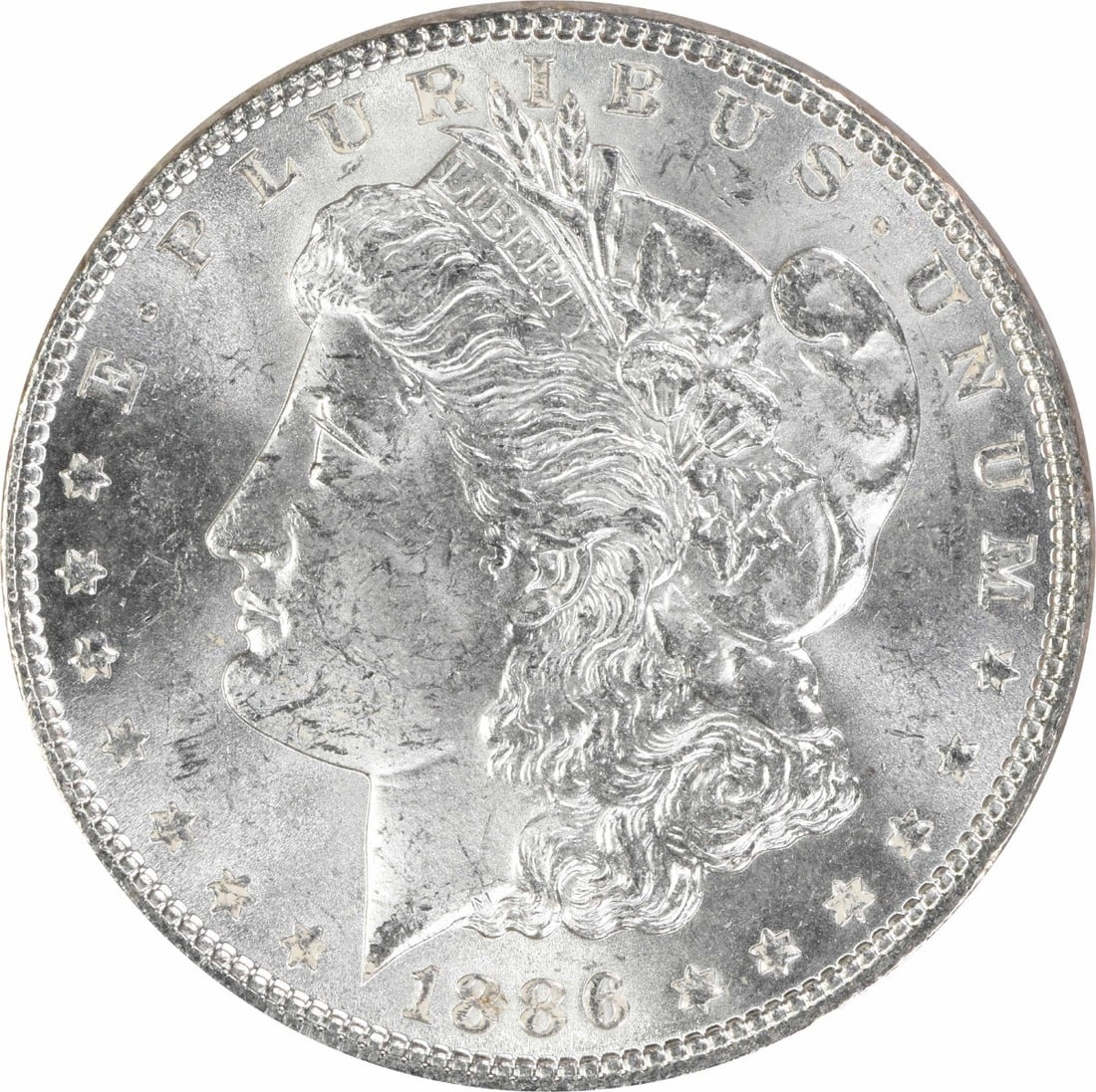 1886 Uncertified Morgan Silver Dollar $1 MS63: 1886 Uncertified Morgan Silver Dollar $1 MS63 1886 Morgan Silver Dollar in uncirculated, pre-owned condition. This uncertified silver $1 coin is identified as KM 110 and listed with an MS63 grade. Spe
