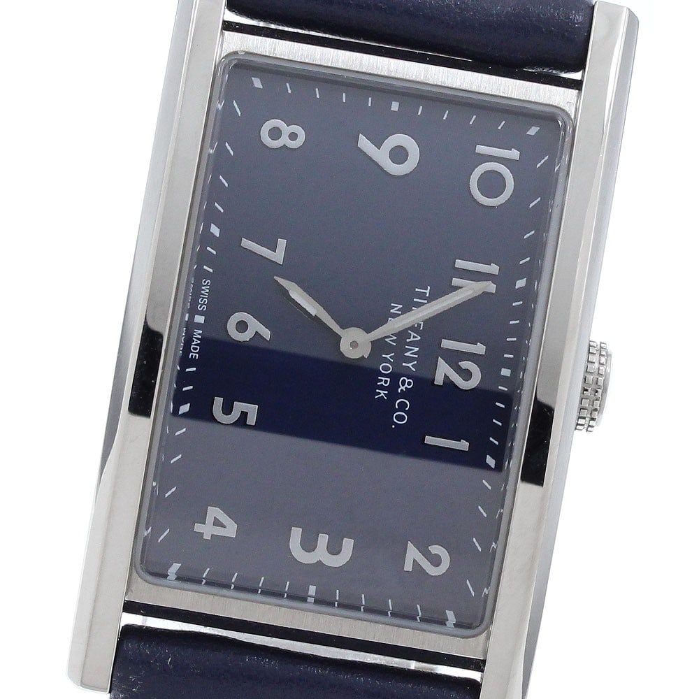 Tiffany Co East West Mini Ladies Quartz Wristwatch Ref 36668644: Tiffany Co East West Mini Ladies Quartz Wristwatch Ref 36668644 Tiffany & Co. East West Mini ladies' wristwatch with a quartz movement and navy dial. This Swiss-made watch features a stainless steel c