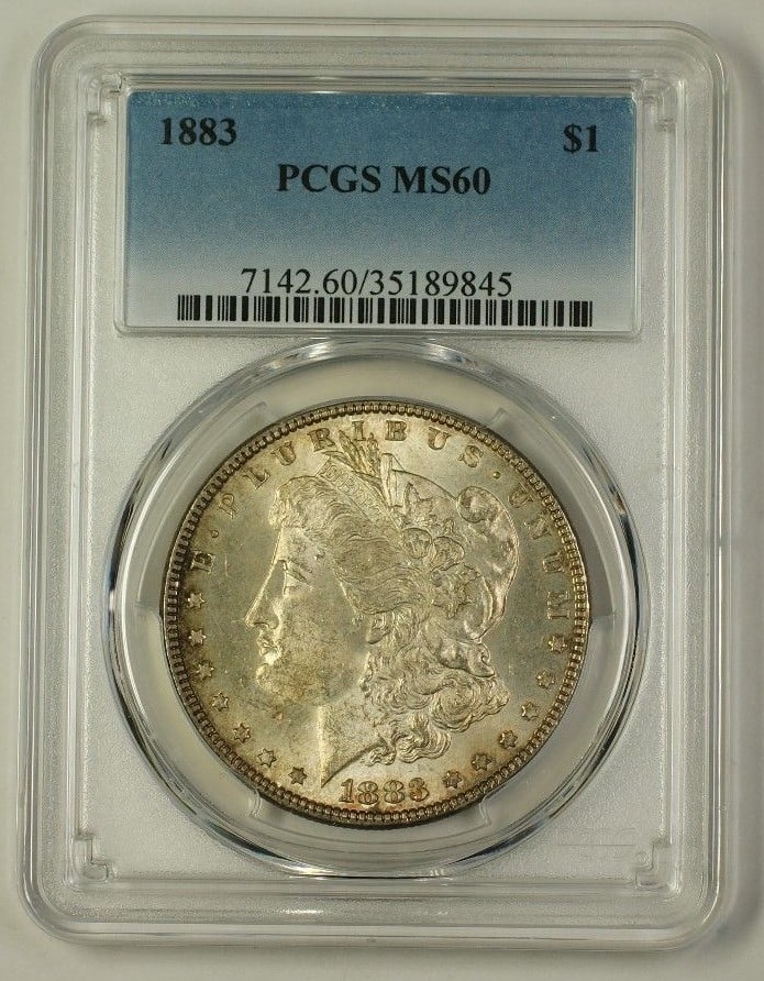 PCGS MS-60 1883 Morgan Dollar $1 Silver Toned: PCGS MS-60 1883 Morgan Dollar $1 Silver Toned 1883 Morgan Silver Dollar $1 coin graded MS-60 by PCGS with a toned appearance. This pre-owned coin is an uncirculated example struck in silver and certif